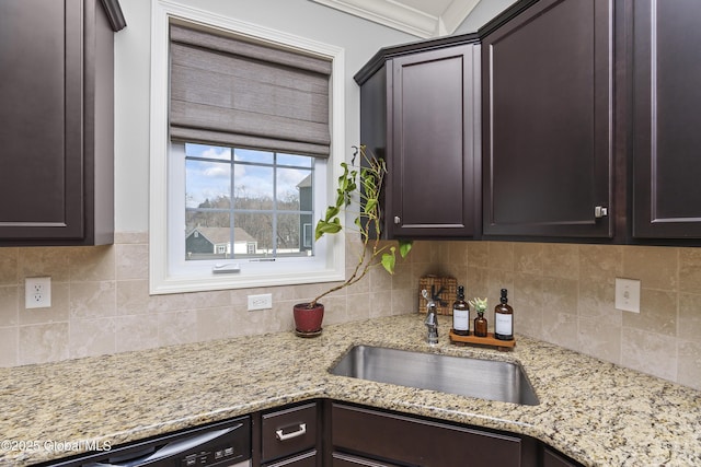 kitchen with a sink and dark brown cabinetry