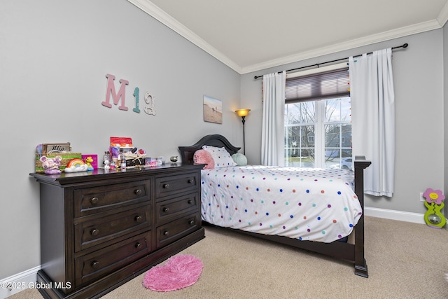 carpeted bedroom featuring crown molding and baseboards