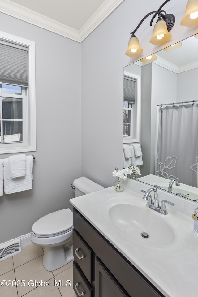 bathroom featuring tile patterned flooring, visible vents, toilet, and crown molding