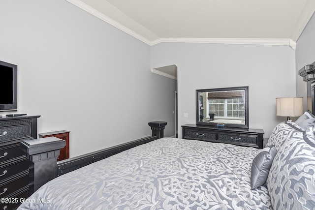 bedroom featuring crown molding, baseboards, and vaulted ceiling