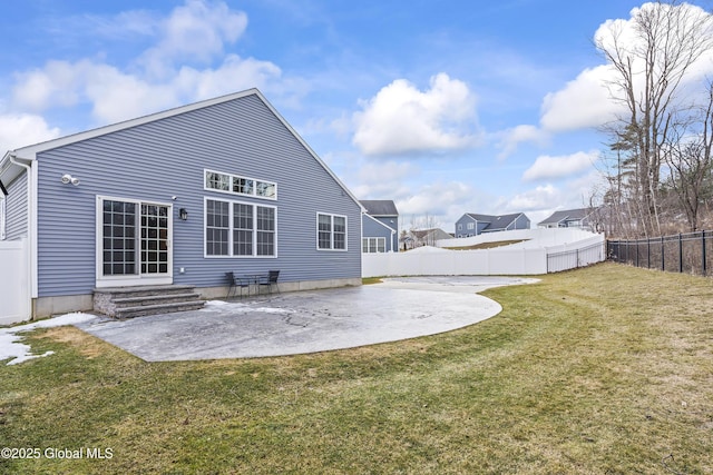 back of property featuring a patio, a lawn, a fenced backyard, and entry steps