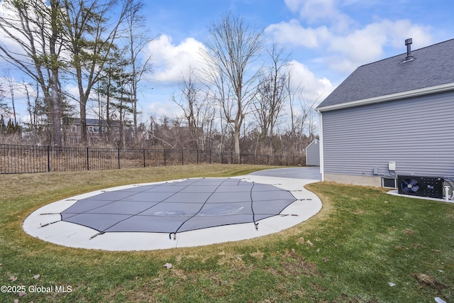 view of swimming pool featuring a lawn, a fenced backyard, and a patio area