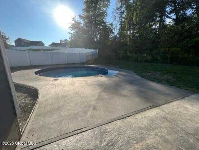 view of pool with a fenced in pool, a patio, and a fenced backyard