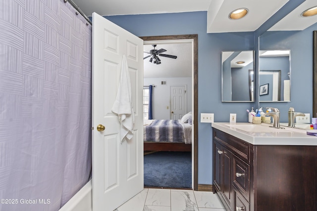 bathroom featuring shower / tub combo, ensuite bathroom, marble finish floor, vanity, and a ceiling fan