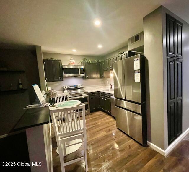 kitchen featuring visible vents, recessed lighting, stainless steel appliances, light countertops, and light wood-style floors