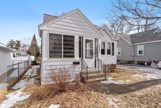 bungalow with entry steps and fence