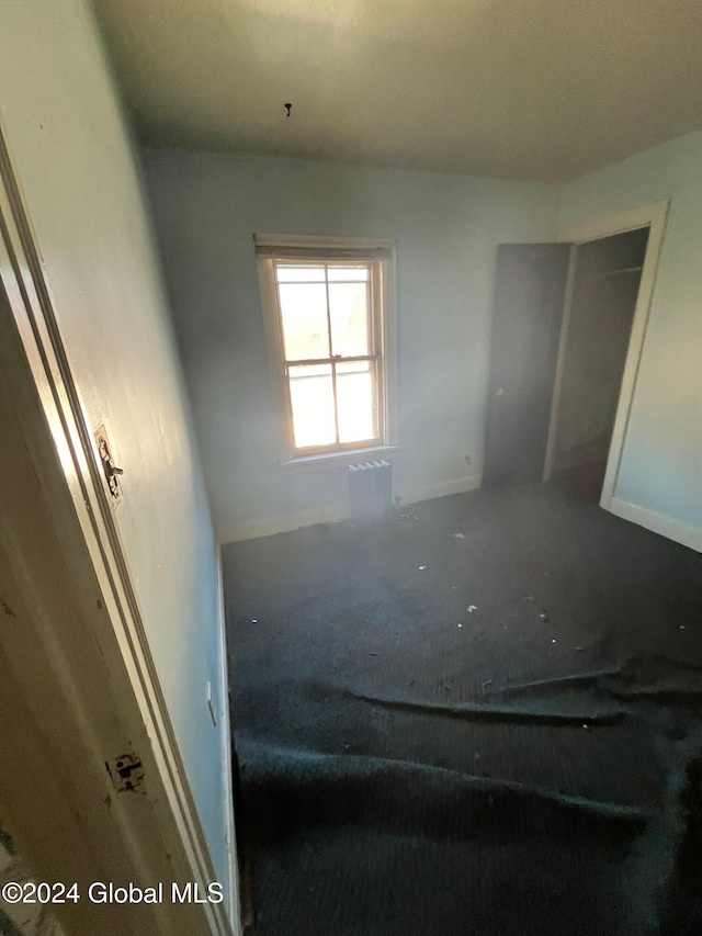 interior space featuring baseboards