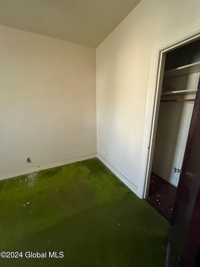 unfurnished bedroom with a closet