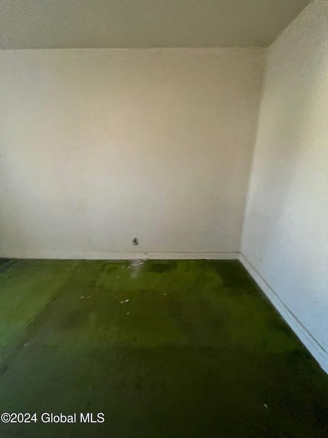 unfurnished room featuring concrete floors