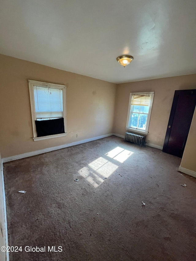 interior space with radiator heating unit and baseboards