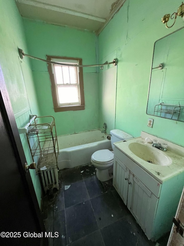 full bathroom featuring toilet, vanity, and tile patterned floors