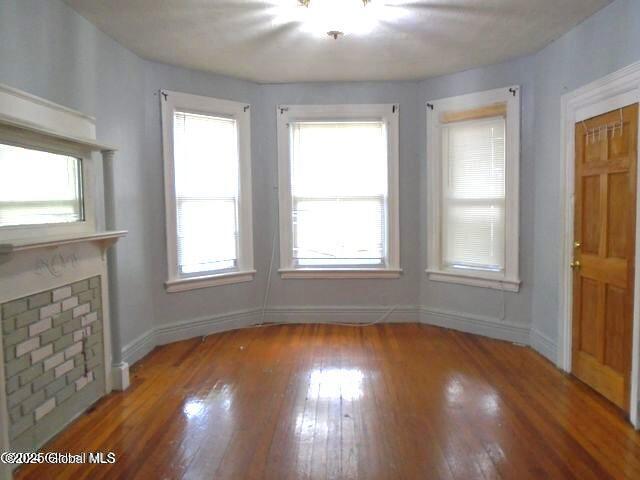 interior space with hardwood / wood-style floors and baseboards