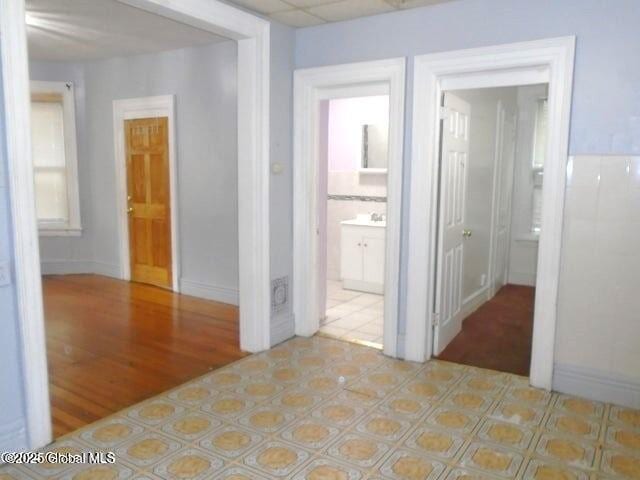 corridor featuring light wood-style floors