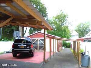 view of parking with a carport