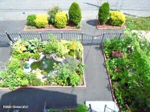 view of yard with a vegetable garden and fence