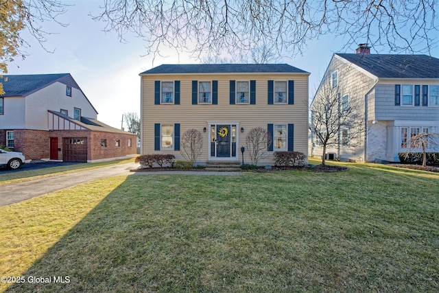 colonial home with a front yard