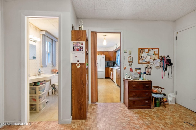 hallway with a sink