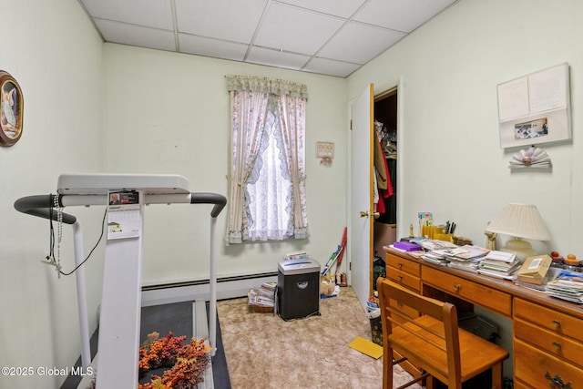 office space with a drop ceiling and a baseboard radiator