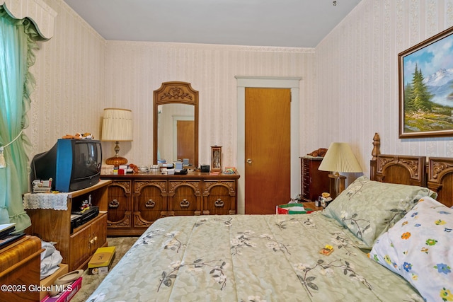 bedroom featuring wallpapered walls