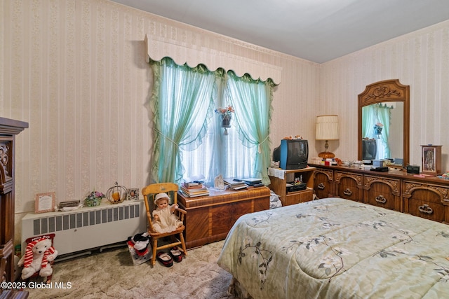 carpeted bedroom featuring wallpapered walls and radiator heating unit