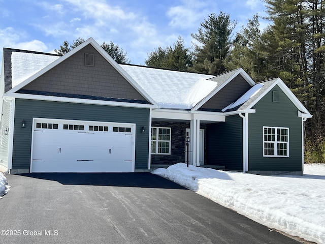 single story home featuring a garage and driveway