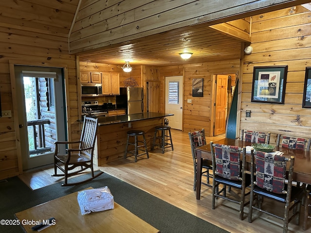 3210 Lake Shore Dr Unit 24Week 7, Lake George, NY 12845 - dining space featuring wooden walls, a wealth of natural light, light wood finished floors, and wood ceiling