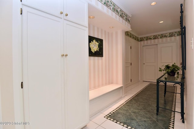 mudroom with light tile patterned floors, recessed lighting, and wallpapered walls