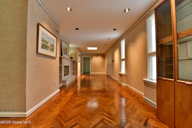 hall featuring visible vents, recessed lighting, and baseboards