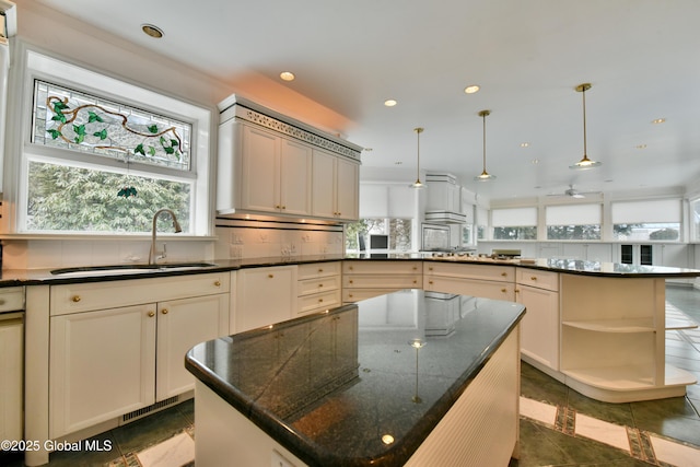 kitchen with tasteful backsplash, a sink, a center island, a peninsula, and open shelves