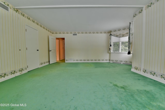 empty room with carpet flooring and visible vents