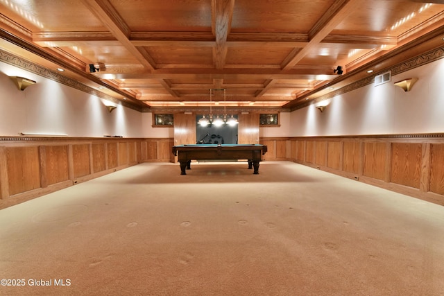 rec room with wooden ceiling, beamed ceiling, a wainscoted wall, and coffered ceiling