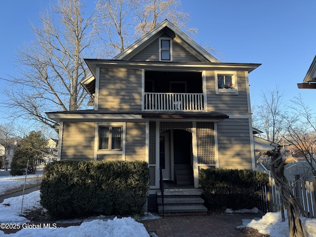 view of front of house with a balcony