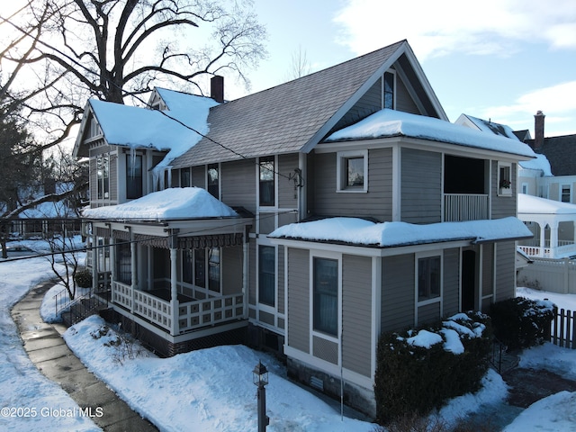 exterior space featuring crawl space, a chimney, and fence