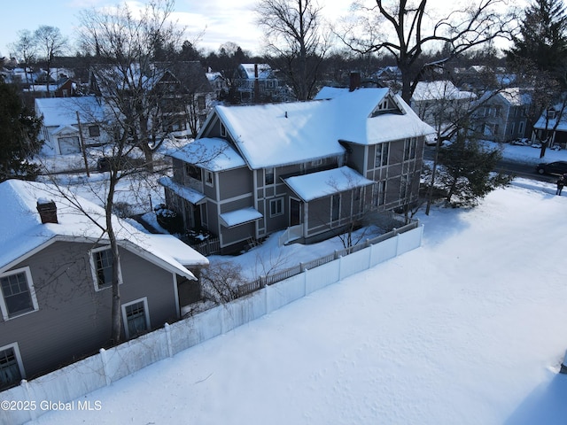 snowy aerial view featuring a residential view