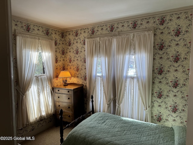 bedroom with wallpapered walls