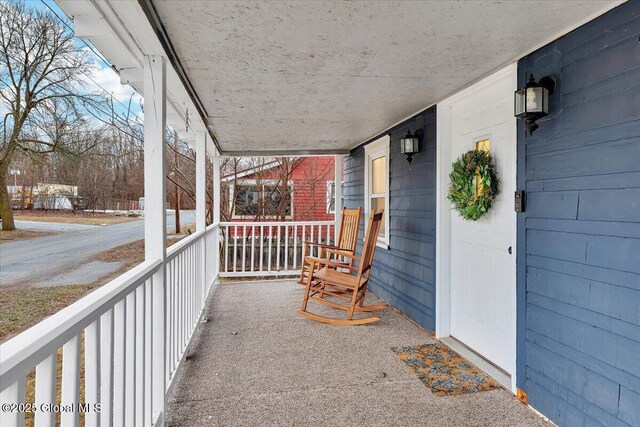 balcony featuring a porch