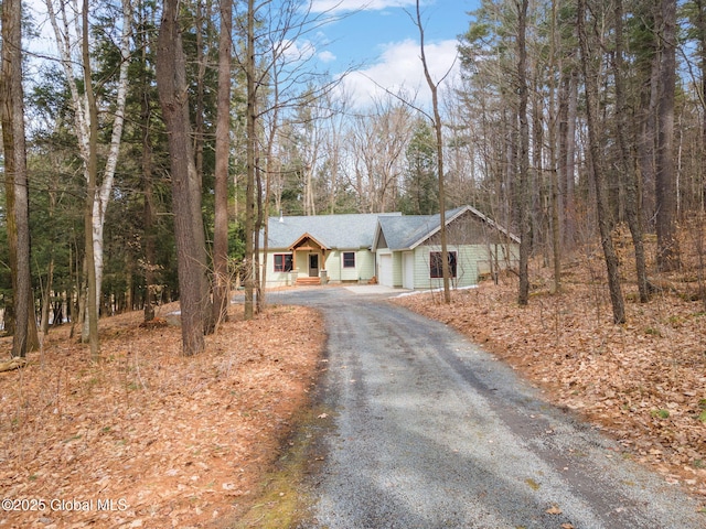 view of front of home featuring gravel driveway