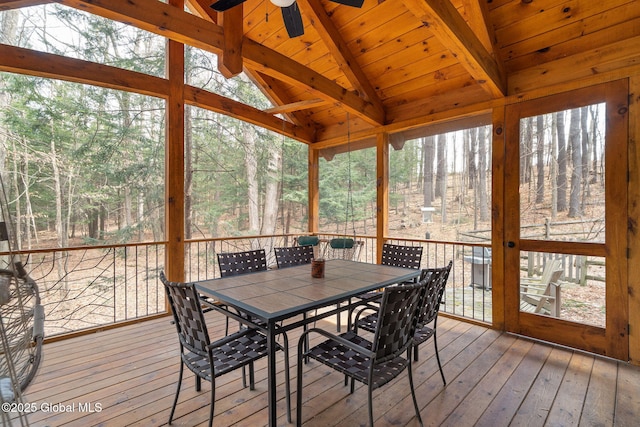 sunroom / solarium with wooden ceiling, lofted ceiling with beams, and a ceiling fan