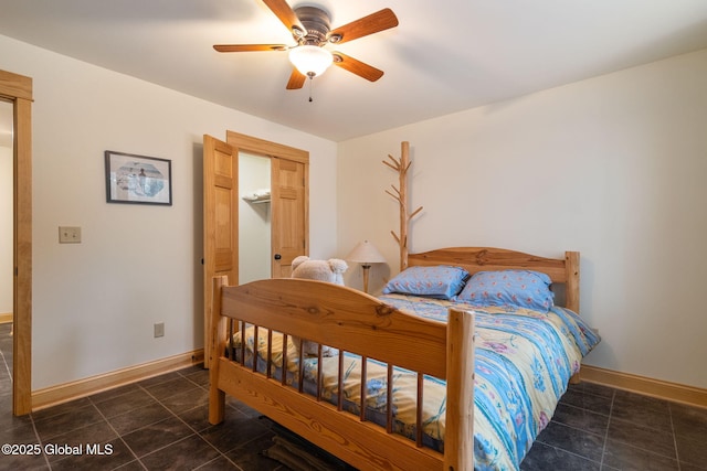 bedroom with baseboards, a ceiling fan, and tile patterned flooring