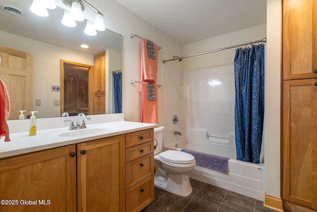 bathroom featuring tile patterned floors, visible vents, toilet, shower / tub combo, and vanity