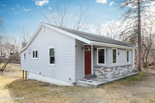 view of front of home featuring stone siding