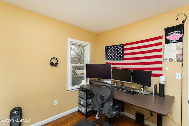 office area featuring baseboards and wood finished floors