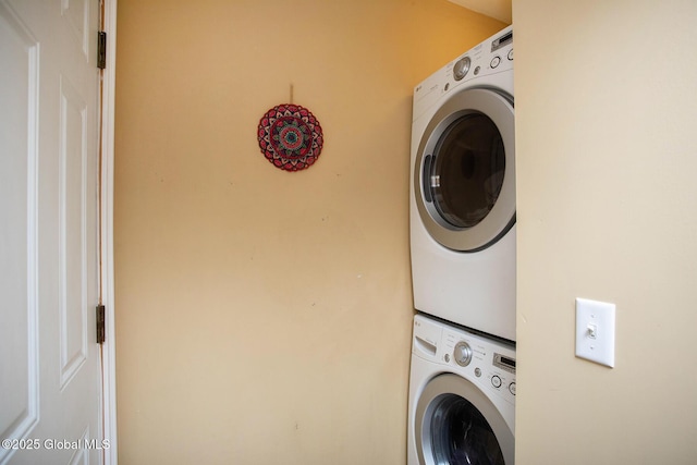 laundry room with laundry area and stacked washing maching and dryer