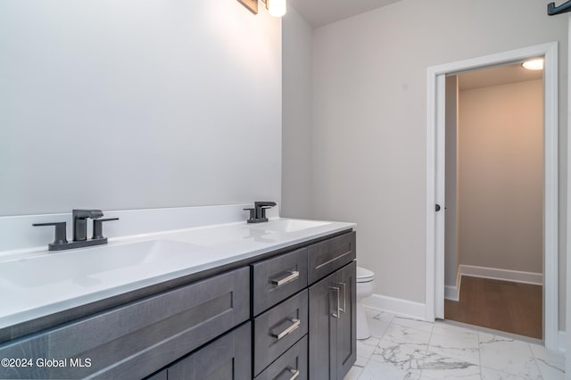 44 Priddle Ln, Colonie, NY 12110 - bathroom featuring marble finish floor, toilet, baseboards, and a sink