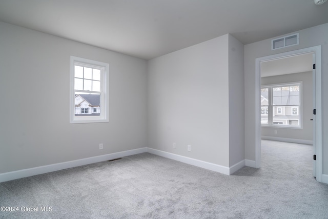 44 Priddle Ln, Colonie, NY 12110 - carpeted empty room featuring baseboards, visible vents, and a wealth of natural light