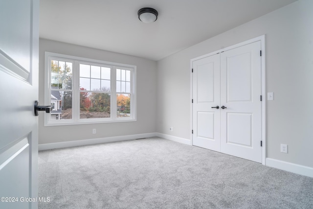 44 Priddle Ln, Colonie, NY 12110 - unfurnished bedroom featuring baseboards, carpet floors, and a closet