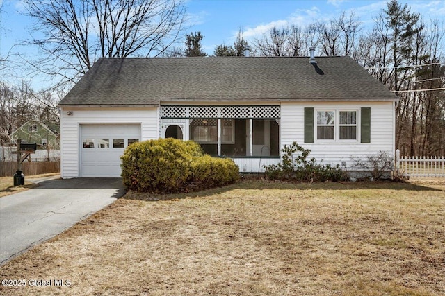 single story home with a shingled roof, fence, concrete driveway, a front yard, and a garage