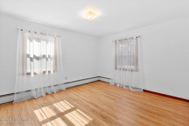 spare room featuring wood finished floors