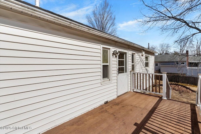 exterior space with a deck and fence