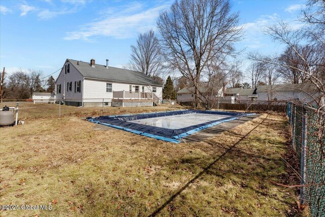 view of pool with a fenced in pool, a yard, and a fenced backyard